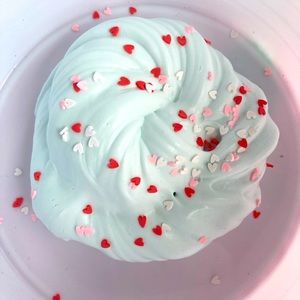 This is my slime show this is a teal fluffy slime